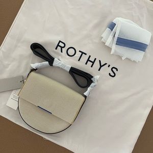 Rothy’s ink and ivory saddle bag